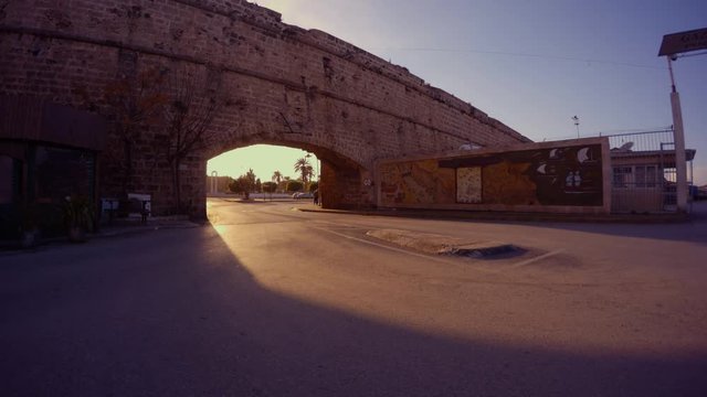asphalt road under the archway from the walls of the medieval ancient fortress of Famagusta
