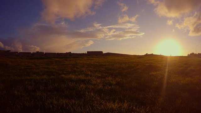 evening sun is washing the field going to the wall of the ancient fortress of Famagusta