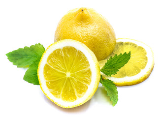 Sliced lemon on fresh green lemon balm leaves isolated on white background.