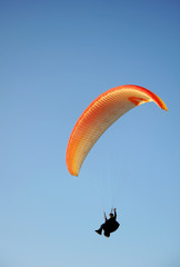Paragliding in the blue sky of Andalusia, Spain