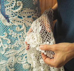 Irish lace crochet. The elements of white knitted dress.