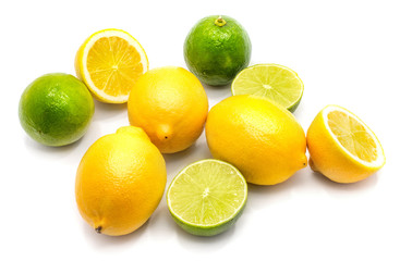 Whole, sliced lemons and limes isolated on white background.