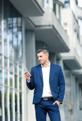 Attractive man in formal suit on city street