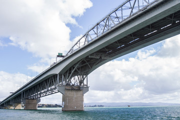 Obraz premium view of Auckland CBD, city center, with sky tower from under the bridge, new zealand
