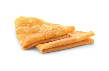 Delicious thin pancakes on white background