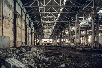 Large empty abandoned warehouse building or factory workshop