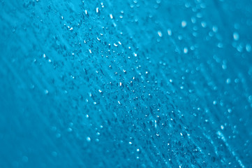 Fototapeta na wymiar Water Drops on textured glass