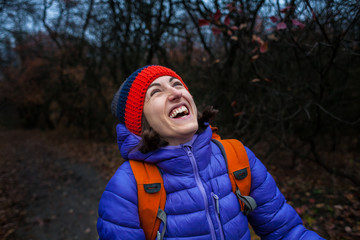 Portrait of a smiling girl with a backpack.