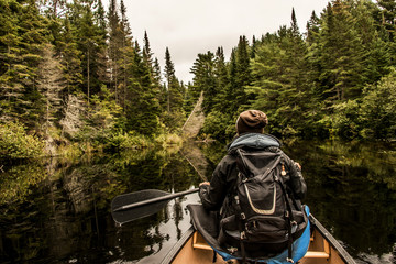 Girl canoeing with Canoe on the lake of two rivers in the algonquin national park in Ontario Canada...