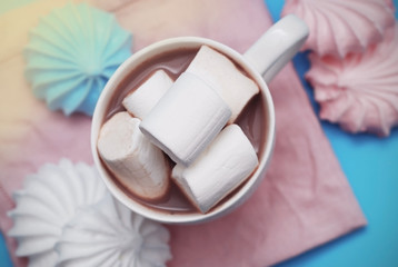 Pink and White Marshmallows zephyr with Cup of Coffee or Cocoa on a pink Napkin