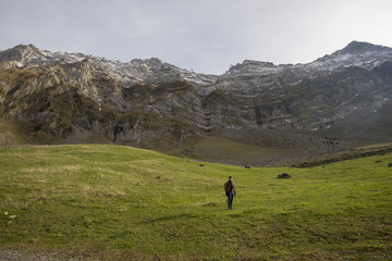 Fototapeta na wymiar Tourist man and Beautiful view of valley mountain Saentis , Switzerland