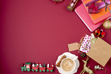 Christmas gifts, book and coffee on a red background