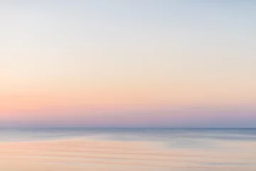 Tuinposter Zonsondergang aan zee Koele zee en lucht-overlay