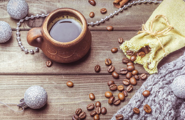 A cup of coffee beans and a bag on the old table. Breakfast.