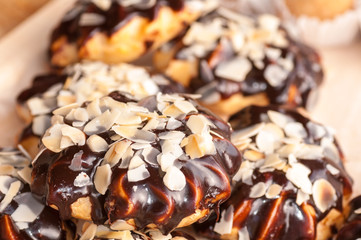 round cakes with chocolate sprinkled with almonds