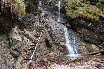 Waterfall and metal ladders in Slovak Paradise National Park - obrazy, fototapety, plakaty