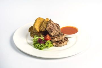 Delicious cutlets with fried potatoes and sauce
