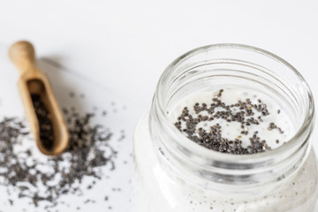 white cocktail with chia seeds, Salvia hispanica