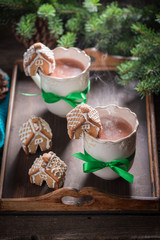 Gingerbread cottages with sweet chocolate in Christmas evening