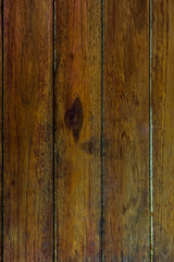 a close-up of a wooden surface with several vertical planks.