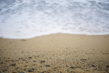Fototapeta na wymiar Beach sand with waves