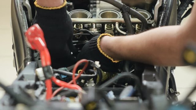 Engineer repair motor of motorcycle