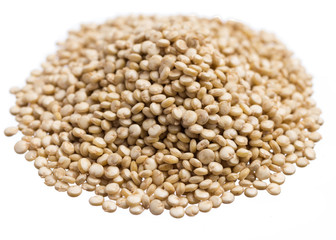 Golden Quinoa. Pile of grains, isolated white background.