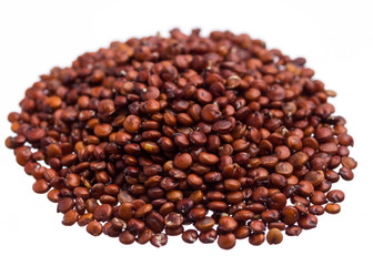 red Quinoa. Pile of grains, isolated white background.