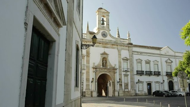 Entrance to old town of Faro, Arco da Villa tourists on excursions.
