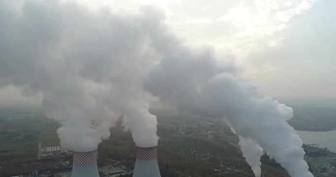 Smoke over forest and power plant. Air pollution