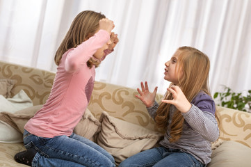 Angry fury girl screaming at her friend or younger sister,
