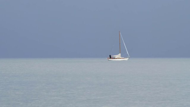 View of boat cruising across the water in the Gulf of Venice from the Piran Coast in Slovenia.