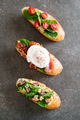 bread with rocket mushroom, rocket tomatoes and bacon egg