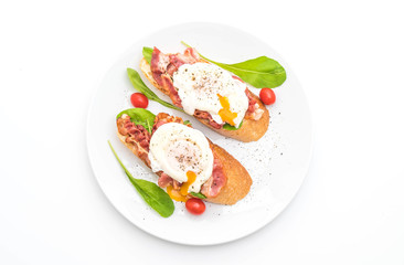 egg benedict on white background