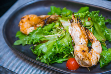Grilled shrimp salad on plate