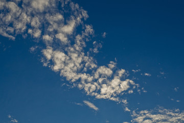 Naklejka na ściany i meble blue sky with clouds background . Summer time. Beautiful sky