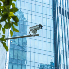 close-up view of security camera, in front of office building..