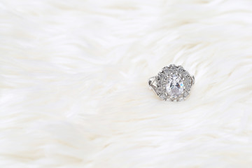 diamond ring on white fabric background