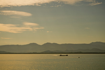 beautiful beach and sea with silhouette boat.Clear sea. Summer time. Relax on holidays. Travel
