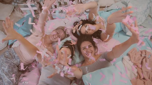 pajama party. girls in pajamas having fun near a Christmas tree