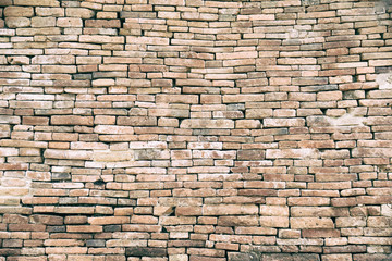 Decorative orange brick wall.Red aged brick wall texture. Building background.Vintage historical old brick wall background