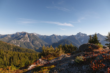 A wide view of the Cascade Mountain Range from a viewpoint along the Mount Dickerman hiking trail.