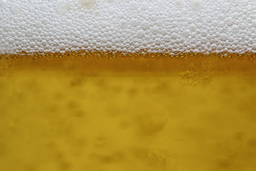 Close up, Background beer bubbles and foam  in glass