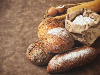 Fresh bread with baking flour and rolling pin