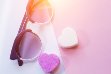 Sunglasses amd pirple candy in shape of heart