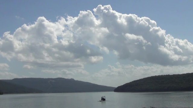 Medium Speed Tennessee River with Big Billowy Cloud and Mountains