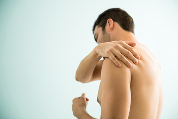 Man with some pain on his shoulder
