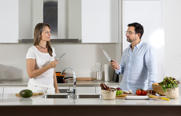 couple ready to fight over food preparation in their kitchen