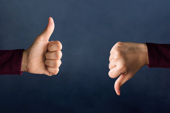 Customer Experience Concept, Hands of Client show Excellent and Bad sign with Thumbs for Rating in Satisfaction Survey, Symbol of Meaning "Great" and "Poor"