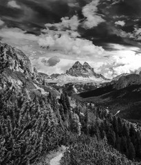 Obraz premium Dynamic surreal clouds running over the Tre Cime di Lavaredo, in the Italian Alps black and white